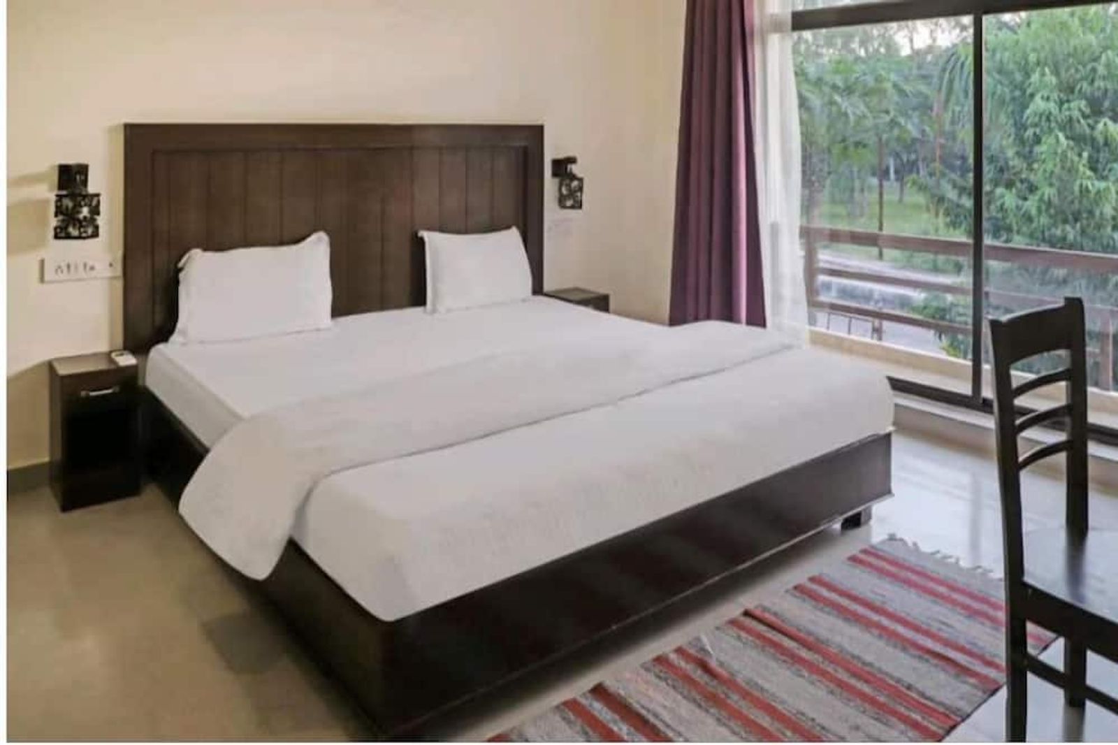 Deluxe king room with garden balcony at Ramayana Hotel Khajuraho